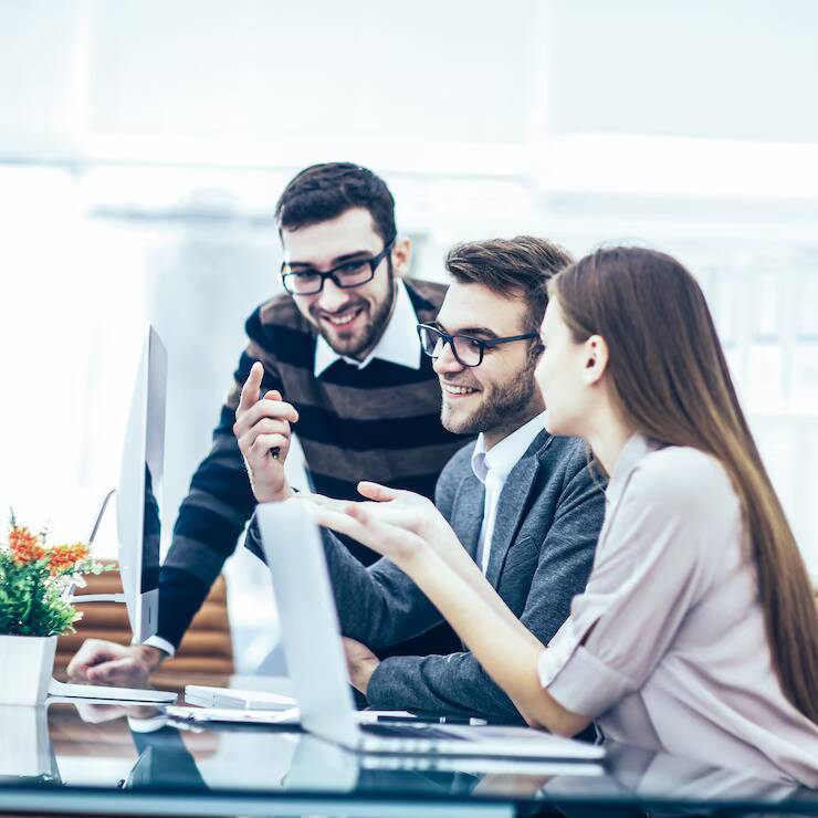 team-of-mobile-app-developers-in-saudi-arabia-collaborating-on-a-new-project-in-a-modern-office